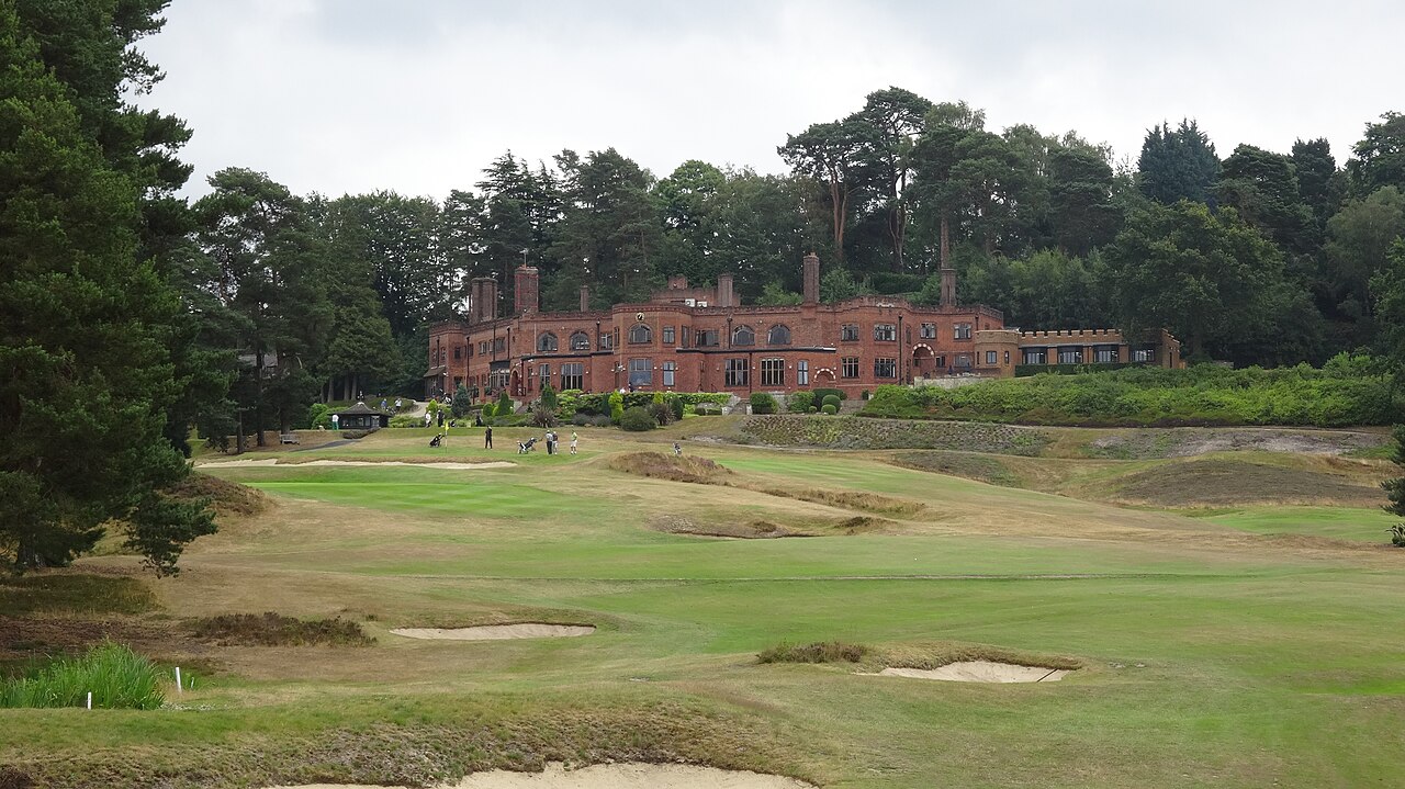 The St George's Hill Golf Club clubhouse above a fairway and bunkers